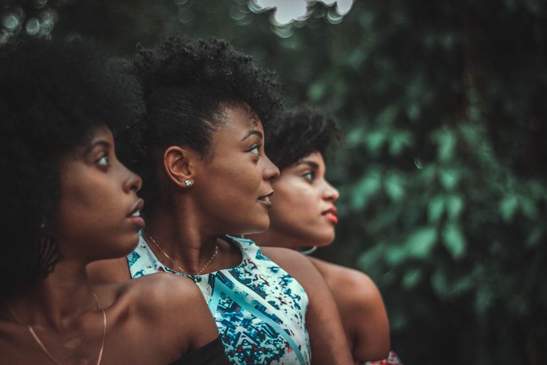 woman-in-blue-and-white-floral-tank-top-beside-woman-in-blue-and-white-floral-tank-p5dbgqooemg